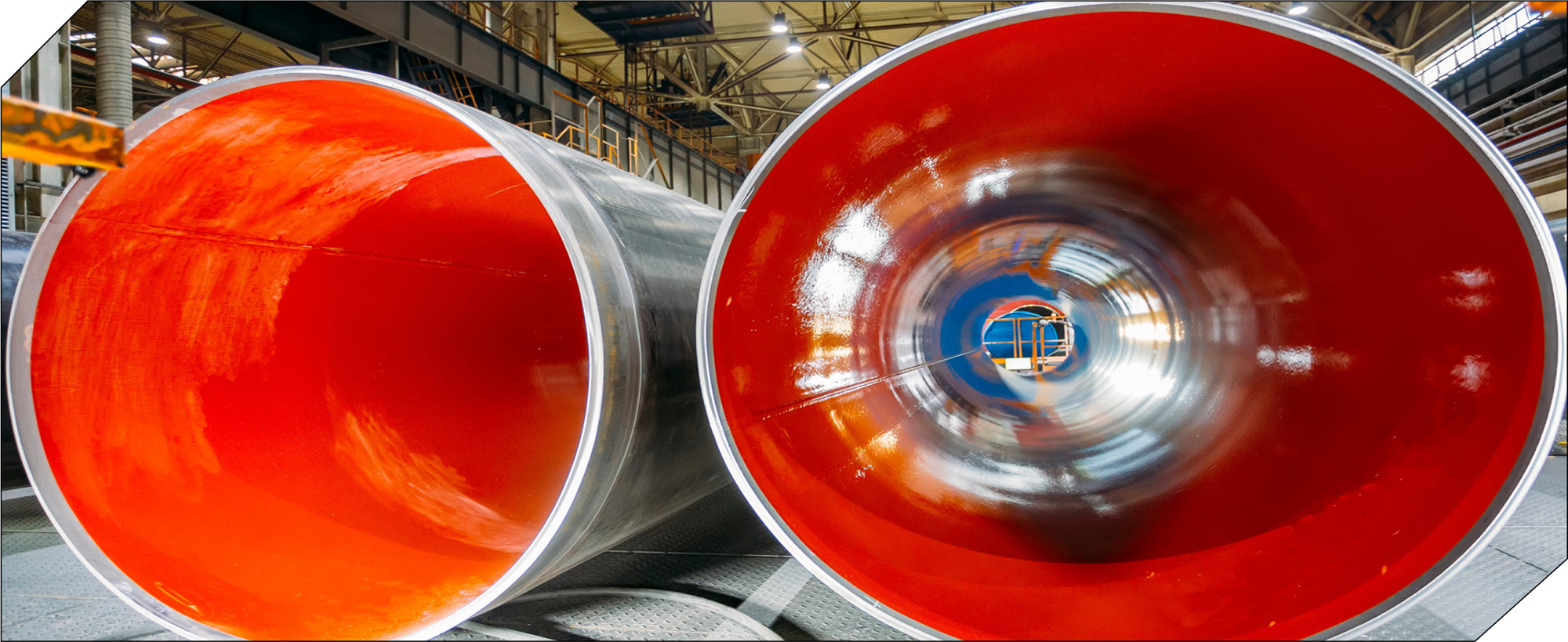 Steel pipe sections with red internal coating